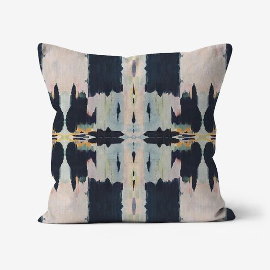 Amelia Boho Batik Throw Pillow featuring a colorful abstract batik print with black, gray, pale pink, light pink, tan, blue, green, yellow, and orange on a linen-textured fabric.
