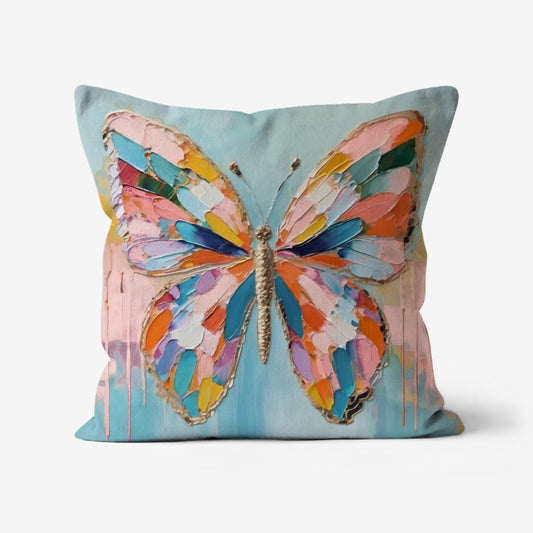 Bohemian Butterfly Wings Throw Pillow featuring a vibrant impasto-style print with blue, teal, pink, yellow, and orange hues on soft linen-textured fabric.