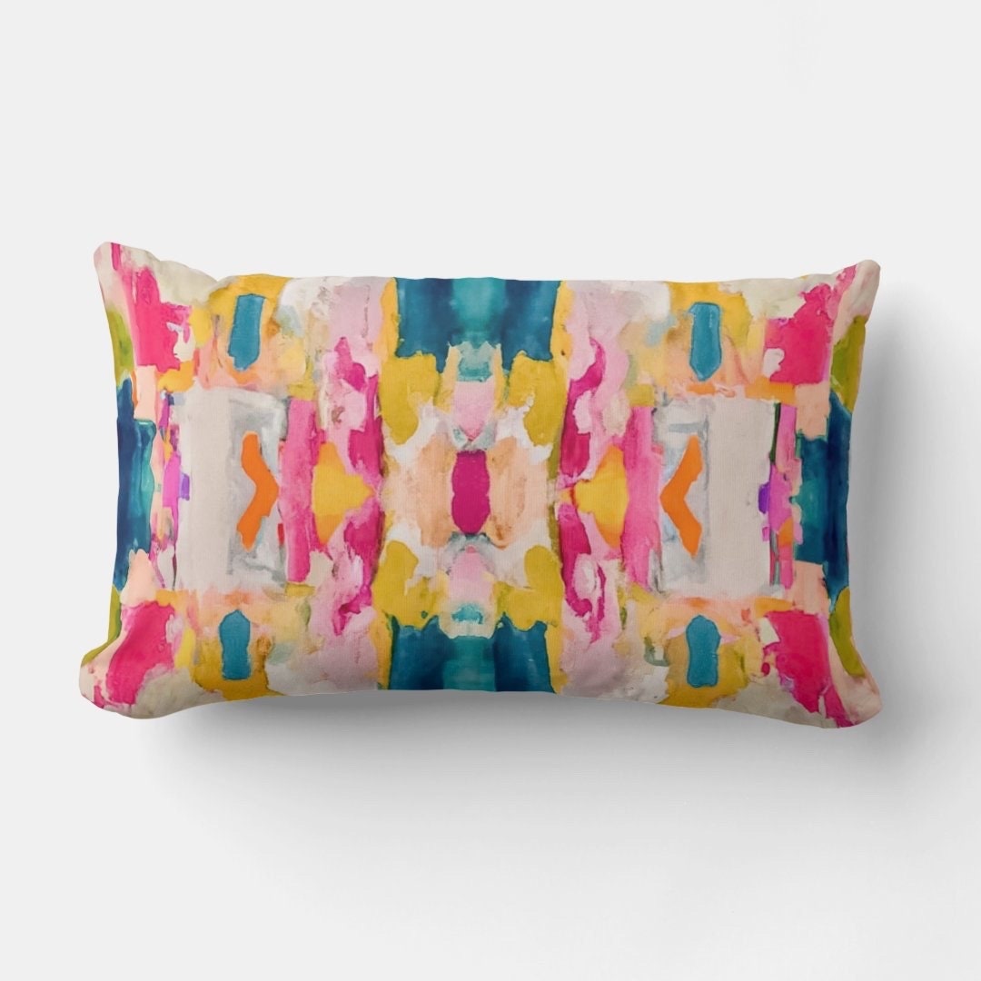Eva Boho Lumbar Throw Pillow featuring an abstract painted design in blue, pink, yellow, green, orange, beige, and grey, with a soft linen-look fabric and hidden zipper.